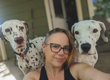Stephanie Conrad has fostered over 300 rescue animals in her home and served on the board of pet organizations. Here she is with her two dogs, Panda (age 9) and Grizzly (age 9). They are both rescue dogs. Photo provided. 